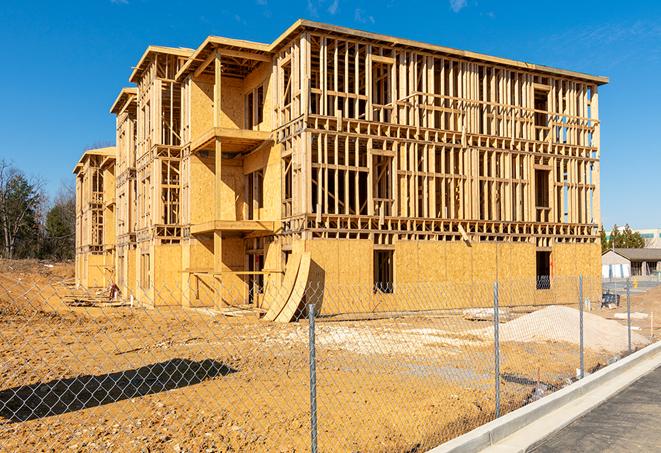 a close-up of temporary chain link fences enclosing a construction site, signaling progress in the project's development in South Pasadena, CA